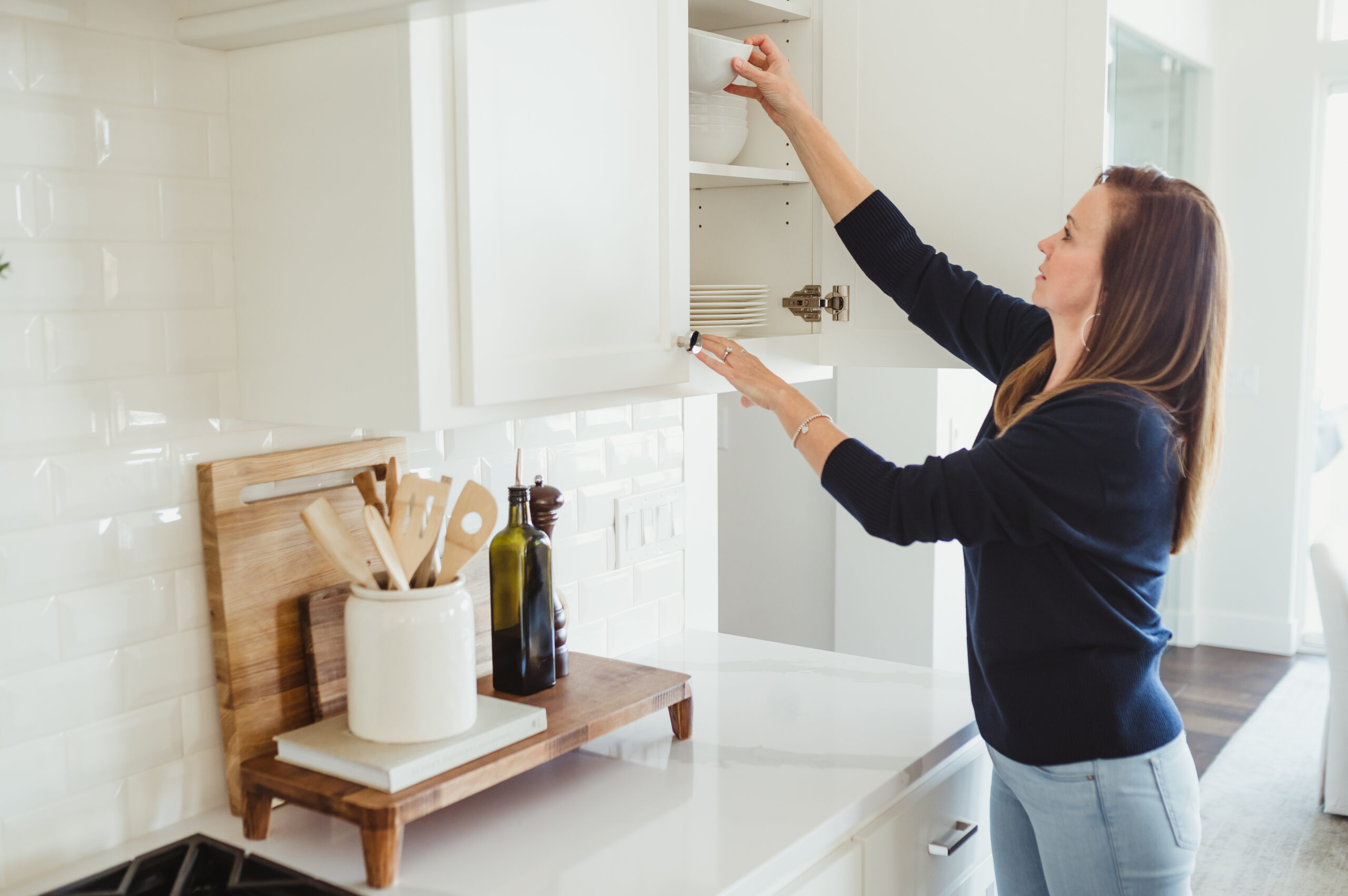 White kitchen with white backsplash organized by 2B Organized Sacramento.