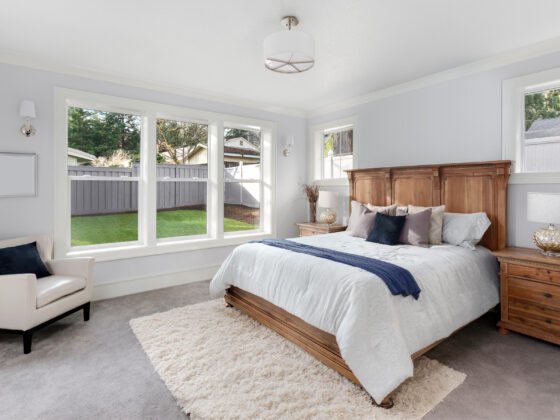 Photo of a beautifully designed and organized guest room by 2B Organized.